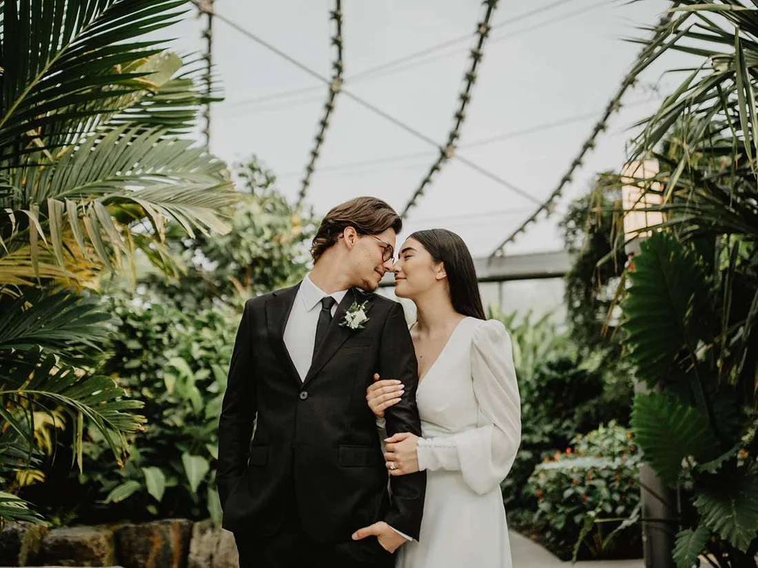 Newlyweds among tropical plants inside the glasshouse biomes at The Leaf